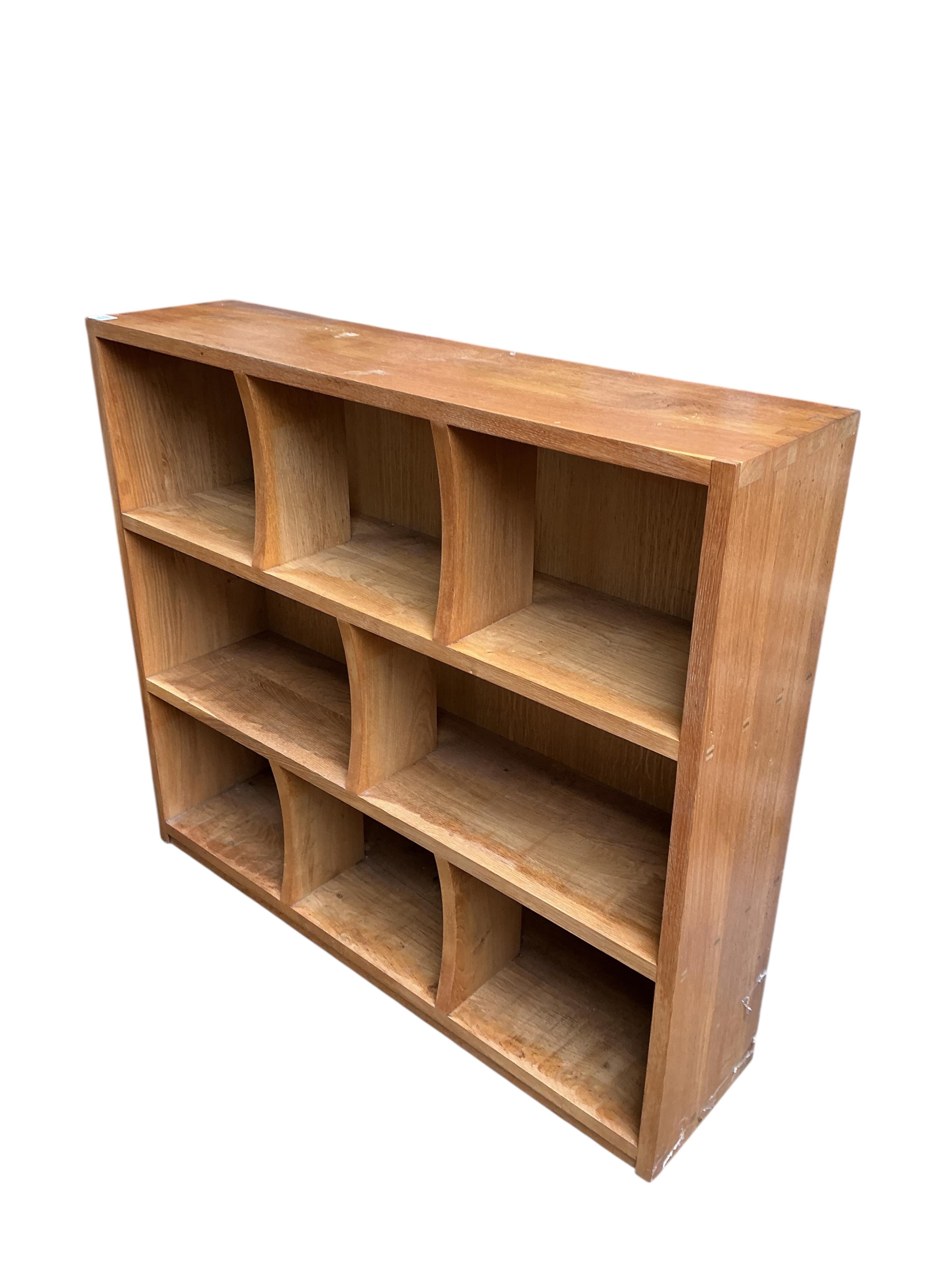 A pair of bespoke oak open bookcases, each width 132cm, depth 30cm, height 107cm